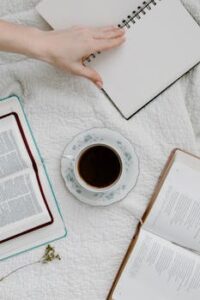 Cup of Coffee Beside Open Books